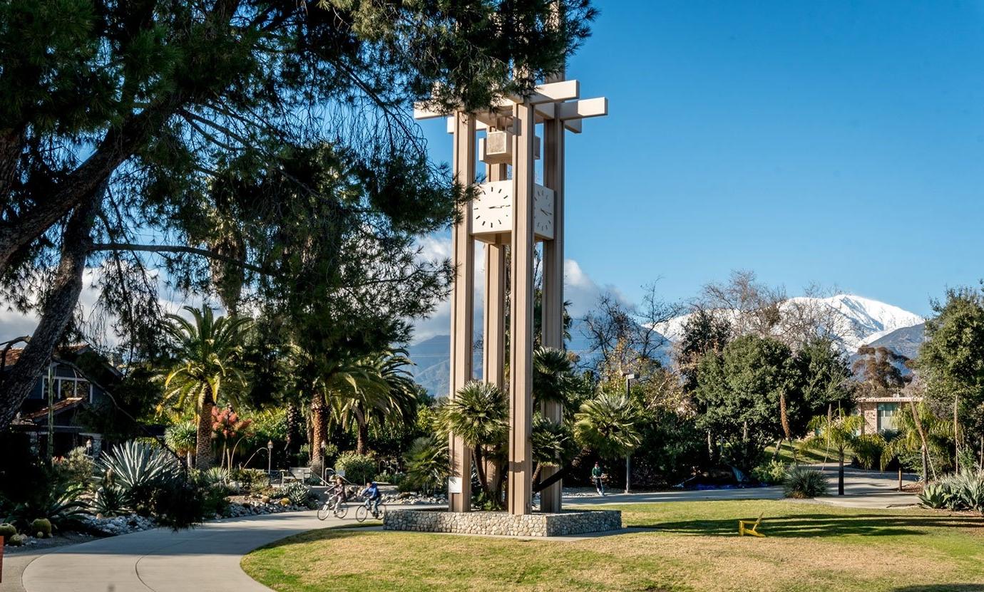 a view of the clock tower with the grove house in the background