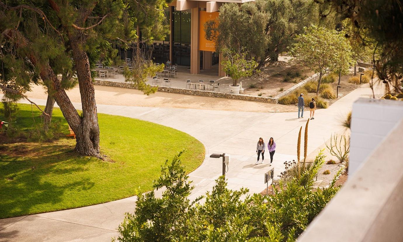 three students walk towards mcconnell dining hall